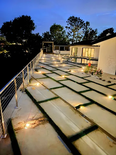Modern concrete paver walkway with lighting